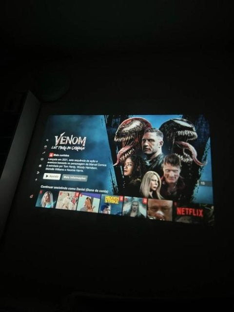 Living room movie night with wall projection